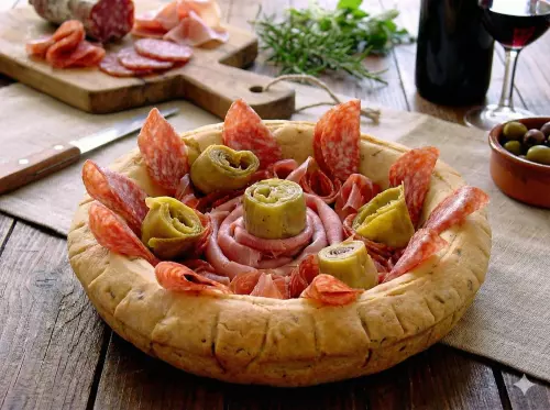 A bread bowl with salami