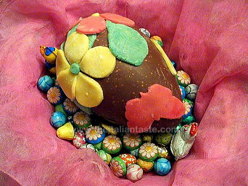 Marzipan flowers and butterflies on a chocolate egg