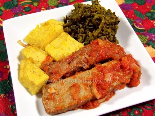 Boiled meat stew with tomatoes and herbs