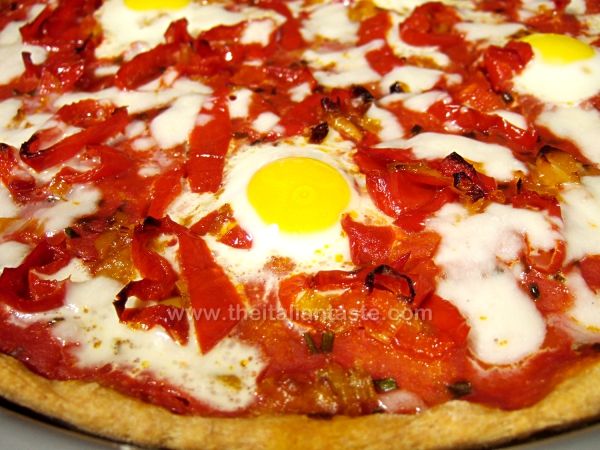 Pizza with sweet peppers and quail eggs