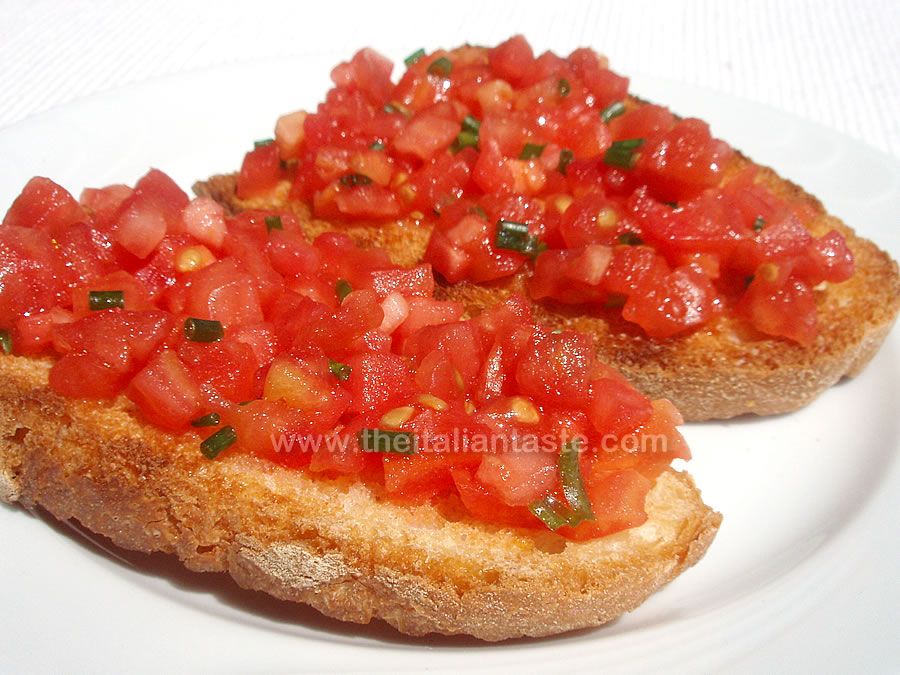 Italian bruschetta with olive oil, garlic and tomatoes