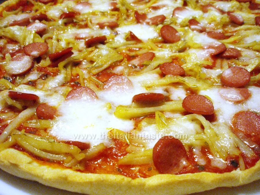 Pizza with potatoes and frankfurters
